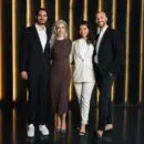 Business Team Of Four Colleagues Standing In Dark Luxury Office