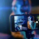 Young woman streaming a live video